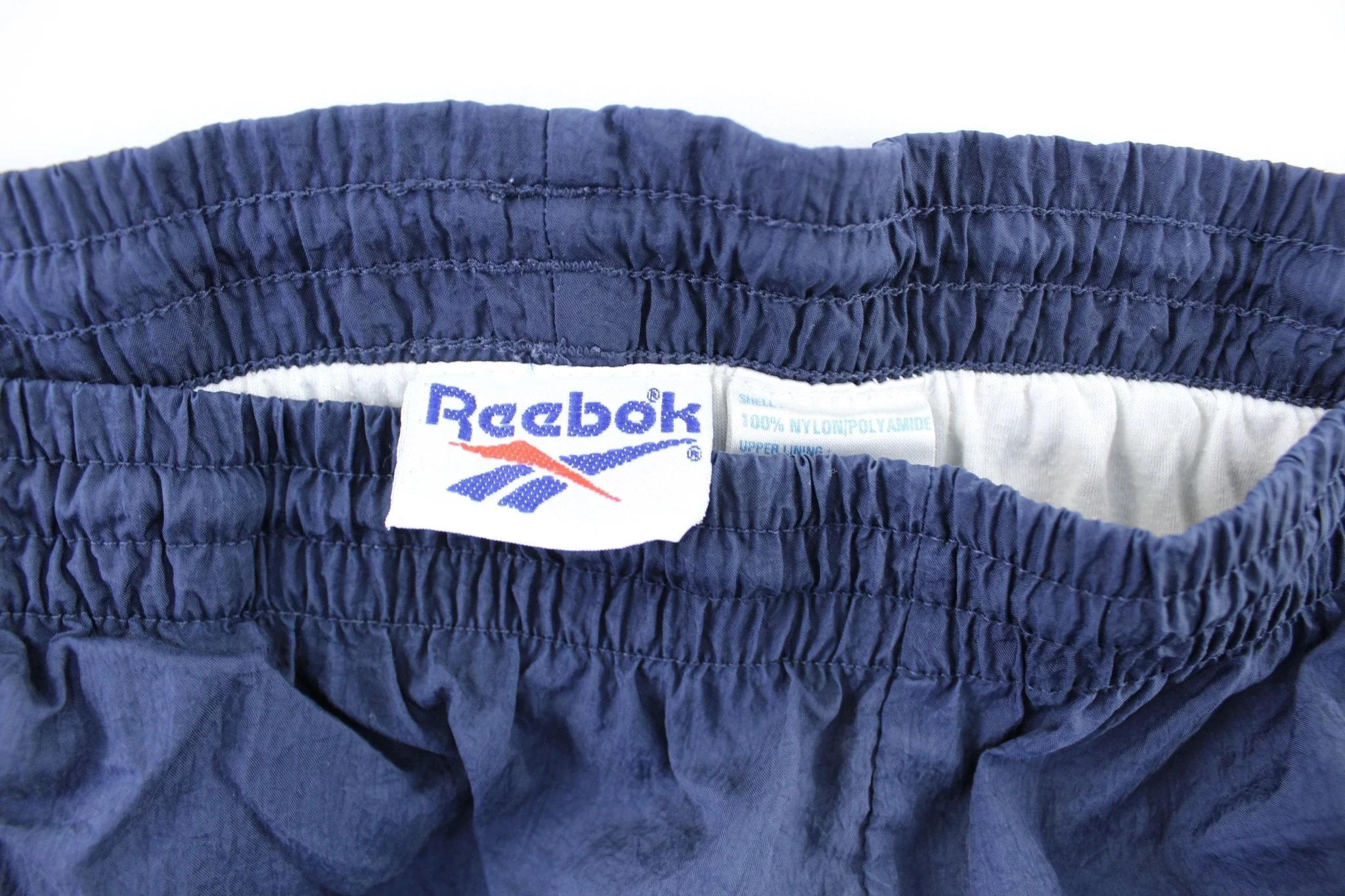 Vintage Reebok Embroidered Logo Navy Blue Windbreaker Pants - Image 5